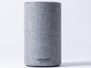 gray jbl portable speaker on white table