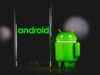 green frog iphone case beside black samsung android smartphone